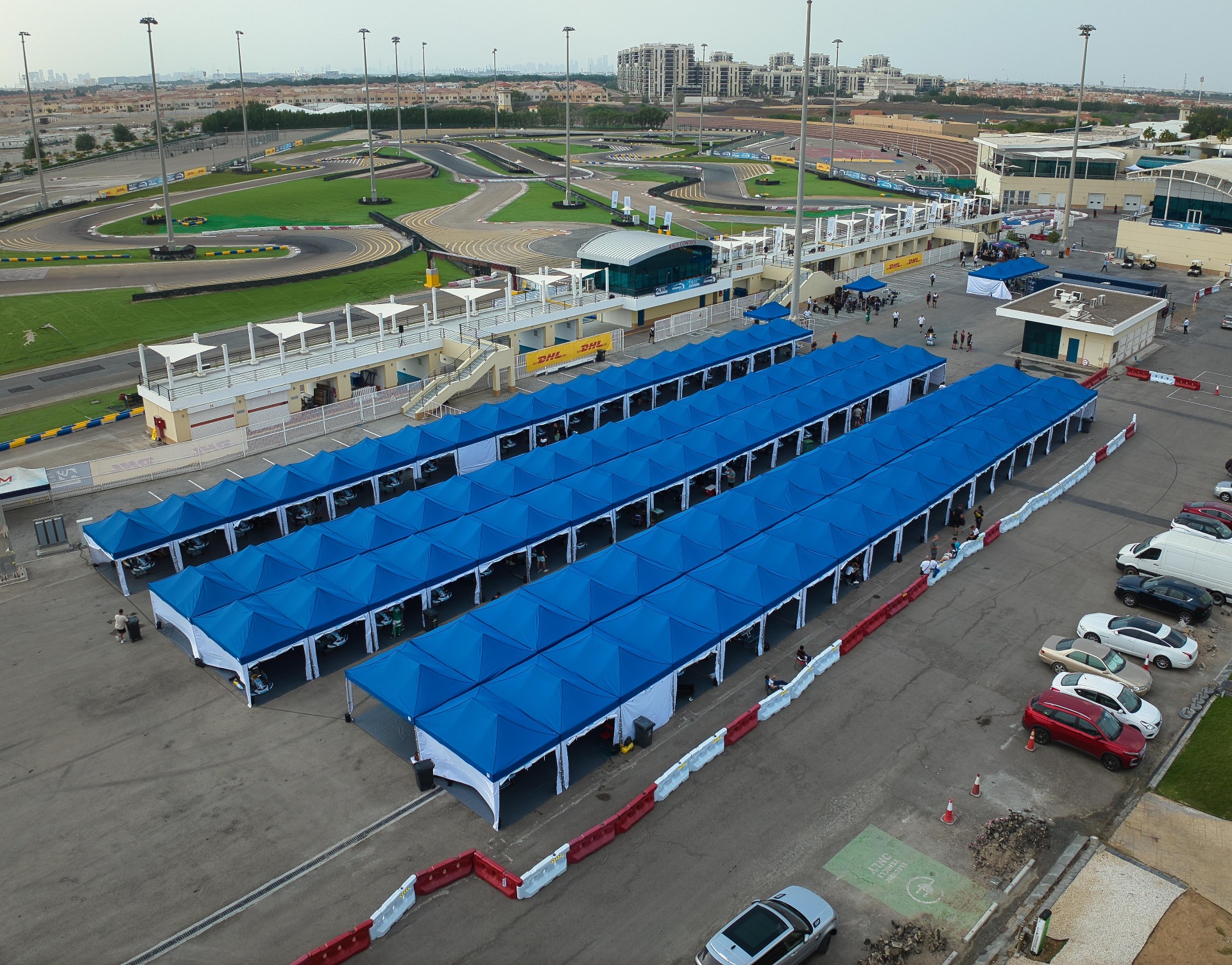 Champions of the Future Academy motorsport paddock tents and race awnings at Bahrain International Karting Circuit